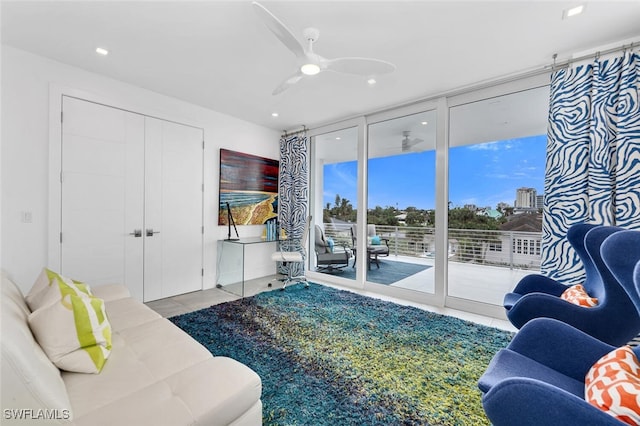 432 Bayside Ave, Naples, FL 34108 - living room with a wall of windows, a ceiling fan, tile patterned flooring, and recessed lighting