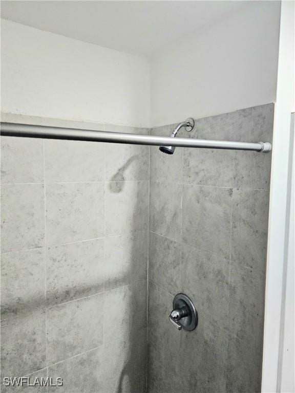 303 E 7th St, Lehigh Acres, FL 33972 - bathroom featuring a shower