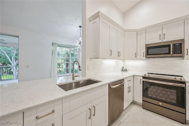 74 Silver Oaks Cir Unit 9-202, Naples, FL 34119 - kitchen with appliances with stainless steel finishes, a sink, tasteful backsplash, and plenty of natural light