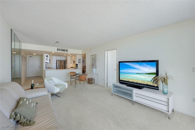 180 Seaview Ct Unit 607, Marco Island, FL 34145 - living room with light carpet and a textured ceiling