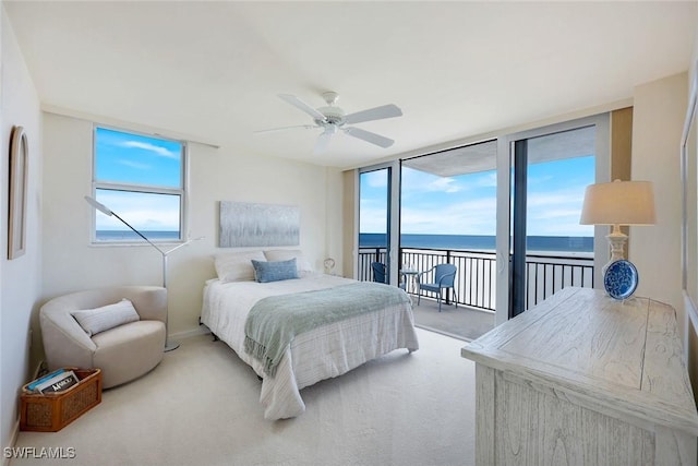 180 Seaview Ct Unit 607, Marco Island, FL 34145 - carpeted bedroom featuring access to outside, a water view, and multiple windows