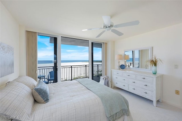 180 Seaview Ct Unit 607, Marco Island, FL 34145 - bedroom with view of water and beach, access to outside, light carpet, expansive windows, and a ceiling fan