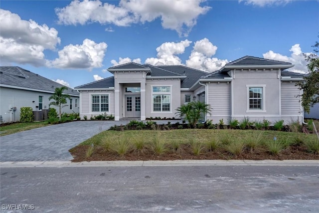 15889 Cranes Marsh Ct, Punta Gorda, FL 33982 - prairie-style home featuring central AC, stucco siding, and a tile roof