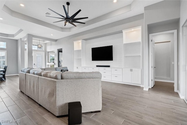 15889 Cranes Marsh Ct, Punta Gorda, FL 33982 - living room with baseboards, a raised ceiling, wood finish floors, a ceiling fan, and recessed lighting