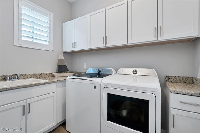 15889 Cranes Marsh Ct, Punta Gorda, FL 33982 - laundry room with separate washer and dryer and cabinet space
