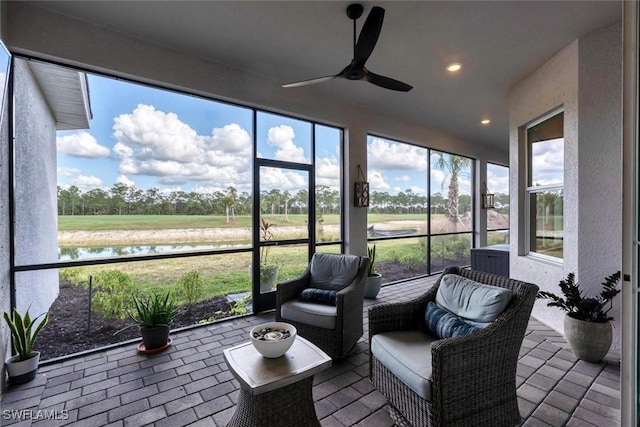 15889 Cranes Marsh Ct, Punta Gorda, FL 33982 - sunroom featuring ceiling fan, a water view, and view of golf course