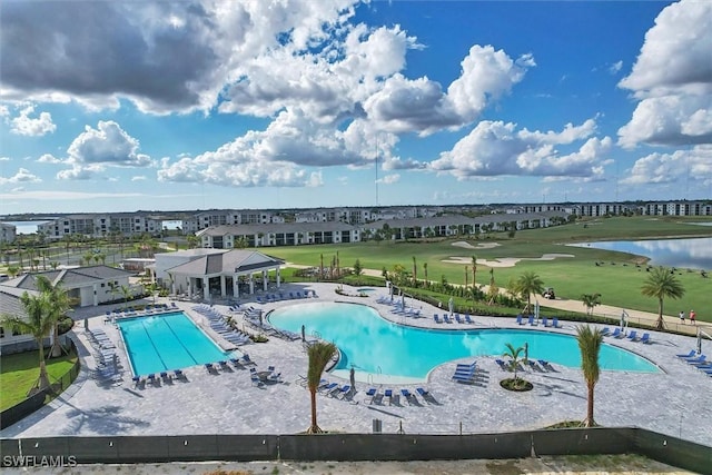 15889 Cranes Marsh Ct, Punta Gorda, FL 33982 - community pool featuring a patio area, view of golf course, and a water view