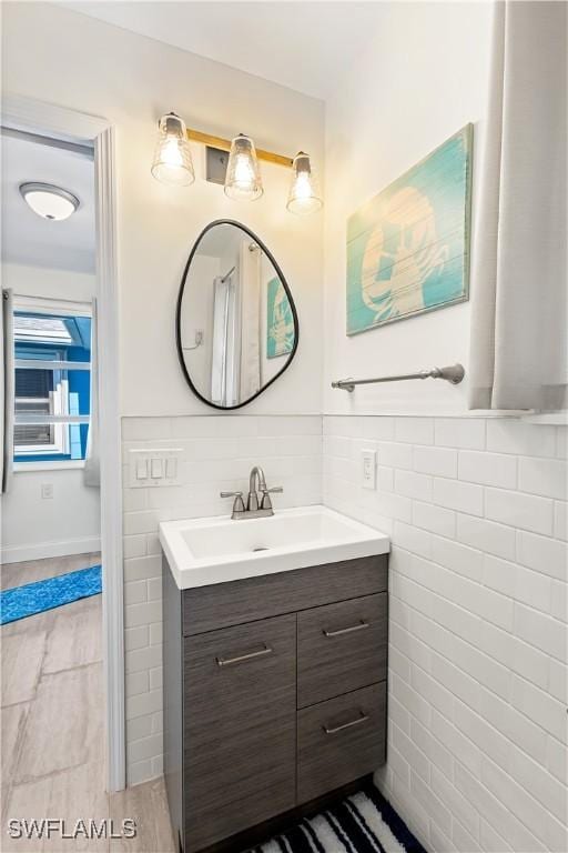 250 Ohio Ave, Fort Myers Beach, FL 33931 - bathroom featuring vanity and tile walls