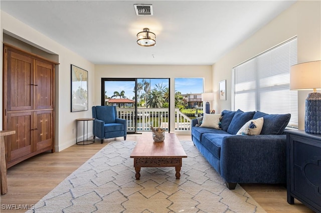 250 Ohio Ave, Fort Myers Beach, FL 33931 - living room with light wood-type flooring and baseboards
