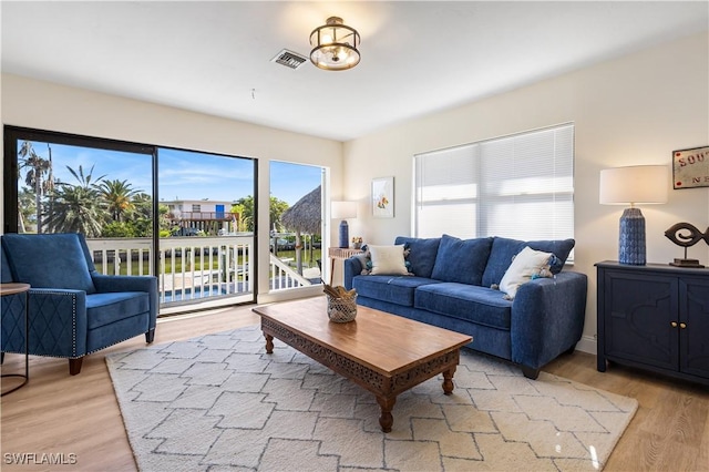 250 Ohio Ave, Fort Myers Beach, FL 33931 - living room with light wood-style flooring