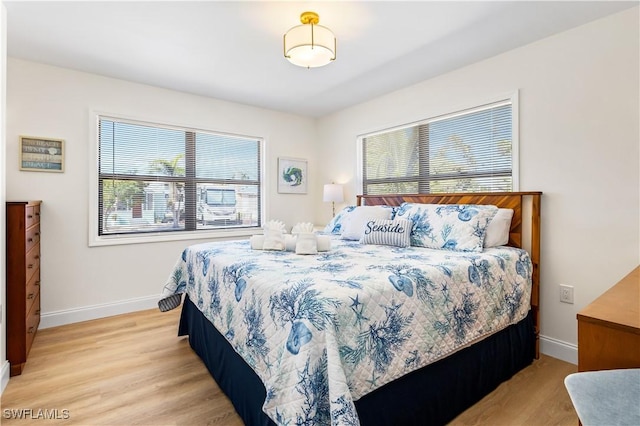 250 Ohio Ave, Fort Myers Beach, FL 33931 - bedroom featuring baseboards and light wood finished floors