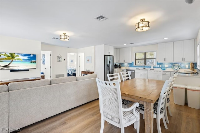 250 Ohio Ave, Fort Myers Beach, FL 33931 - dining space featuring light wood-style flooring