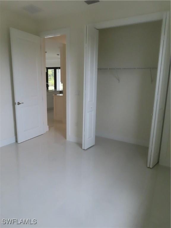 4132 64th Ave NE, Naples, FL 34120 - unfurnished bedroom featuring a closet