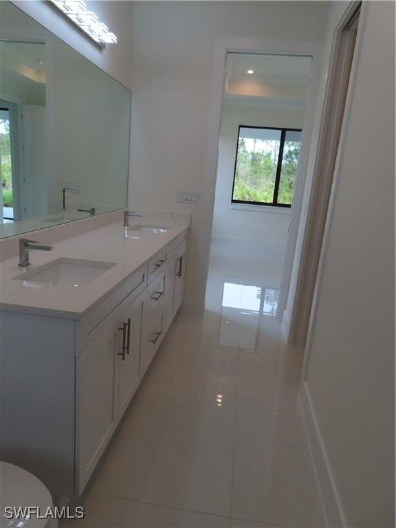 4132 64th Ave NE, Naples, FL 34120 - bathroom with tile patterned floors and double vanity