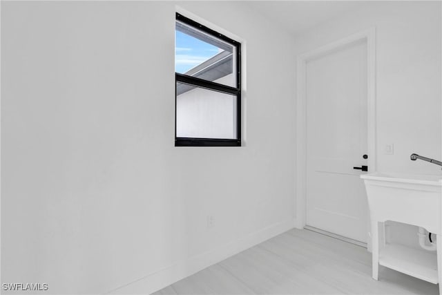 331 Naples Ave S, Lehigh Acres, FL 33974 - spare room with wood finished floors and baseboards