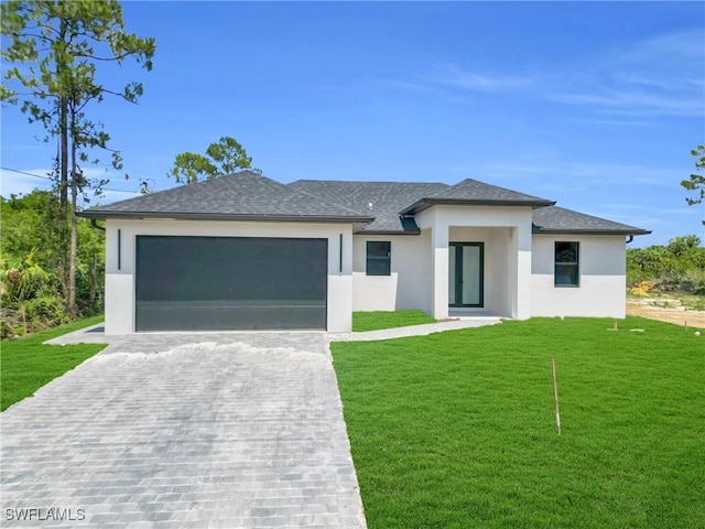 331 Naples Ave S, Lehigh Acres, FL 33974 - prairie-style house with stucco siding, decorative driveway, an attached garage, a front yard, and a shingled roof
