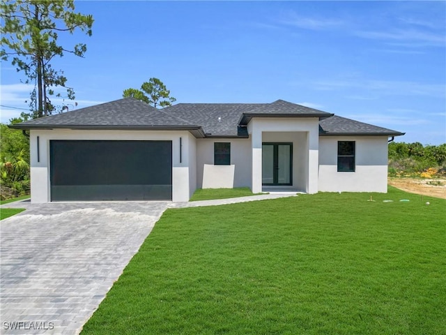 331 Naples Ave S, Lehigh Acres, FL 33974 - view of front of property with a garage, stucco siding, decorative driveway, a shingled roof, and a front yard