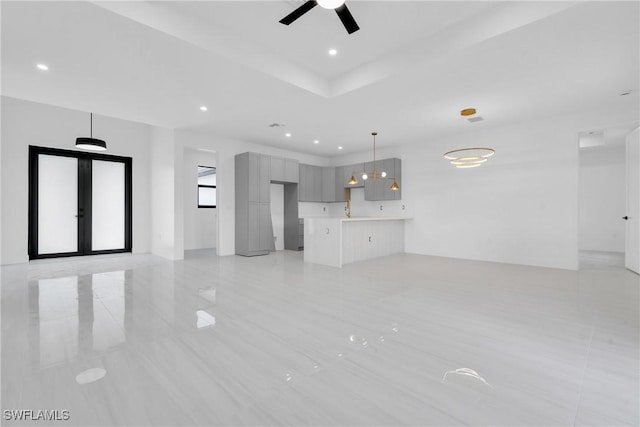 331 Naples Ave S, Lehigh Acres, FL 33974 - unfurnished living room with a ceiling fan, recessed lighting, french doors, and light tile patterned floors