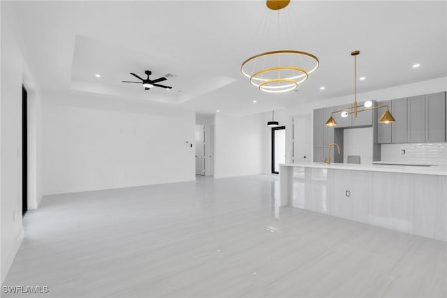 331 Naples Ave S, Lehigh Acres, FL 33974 - unfurnished living room with a sink, recessed lighting, light wood finished floors, and a ceiling fan