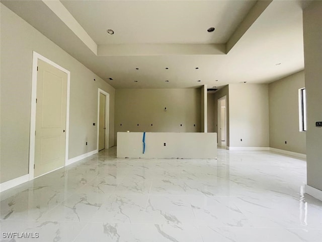 1601 W 9th St, Lehigh Acres, FL 33972 - unfurnished room featuring a raised ceiling, light marble finish flooring, baseboards, and recessed lighting