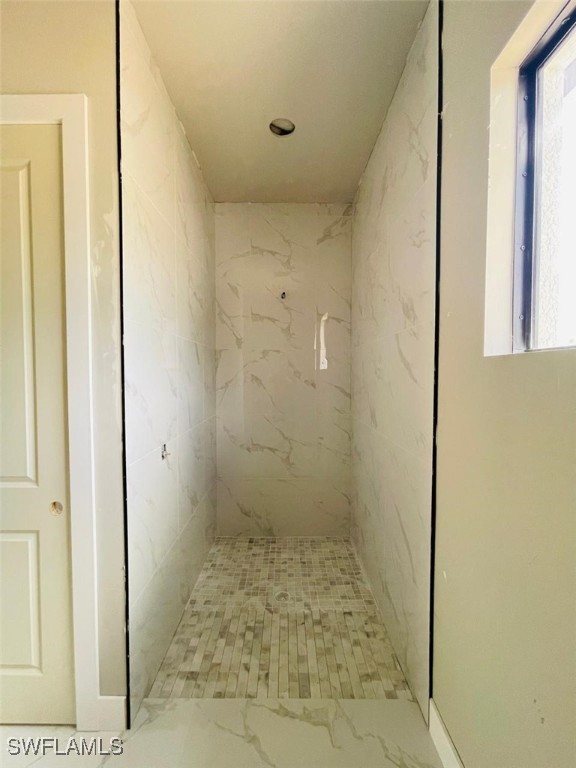 1601 W 9th St, Lehigh Acres, FL 33972 - full bathroom with marble finish floors and a marble finish shower