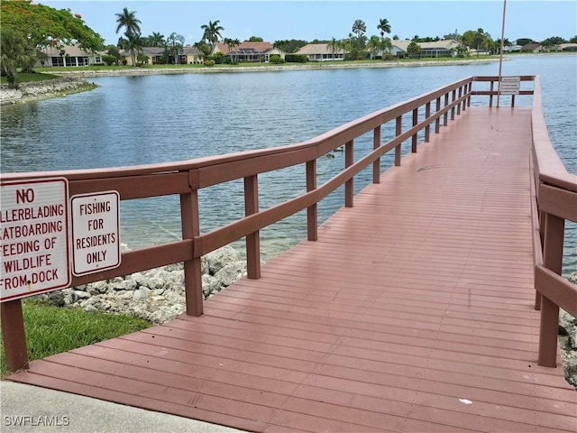 605 Squire Cir Unit 203, Naples, FL 34104 - dock area featuring a water view and a residential view