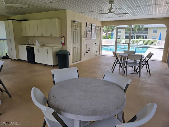 605 Squire Cir Unit 203, Naples, FL 34104 - dining space featuring ceiling fan and finished concrete flooring
