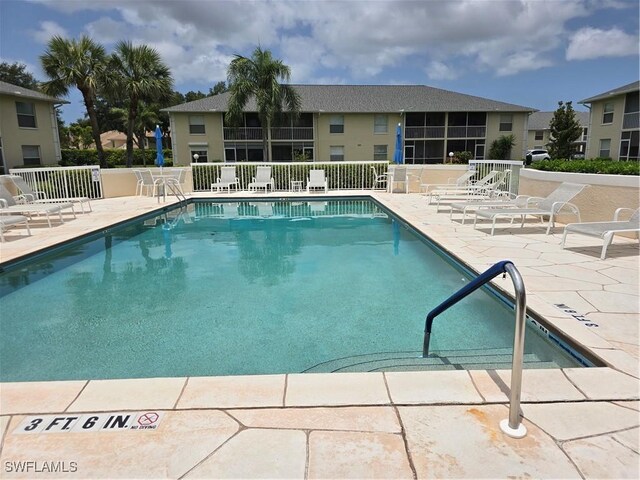 605 Squire Cir Unit 203, Naples, FL 34104 - community pool with a patio area