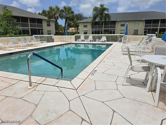 605 Squire Cir Unit 203, Naples, FL 34104 - community pool featuring a patio area