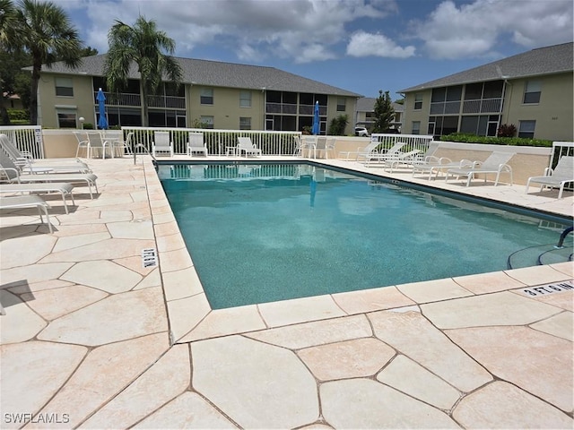 605 Squire Cir Unit 203, Naples, FL 34104 - community pool with a patio