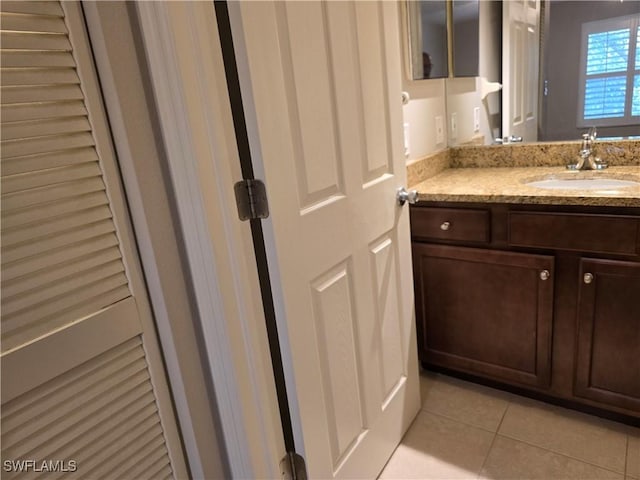 605 Squire Cir Unit 203, Naples, FL 34104 - bathroom with tile patterned floors and vanity