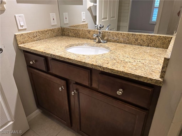 605 Squire Cir Unit 203, Naples, FL 34104 - bathroom with vanity and tile patterned flooring