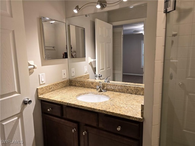 605 Squire Cir Unit 203, Naples, FL 34104 - bathroom with vanity and a shower stall