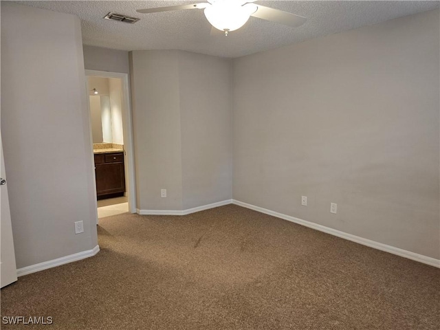 605 Squire Cir Unit 203, Naples, FL 34104 - spare room featuring carpet flooring and a ceiling fan