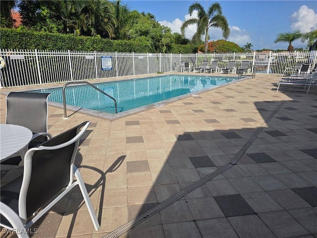 605 Squire Cir Unit 203, Naples, FL 34104 - community pool with a patio area