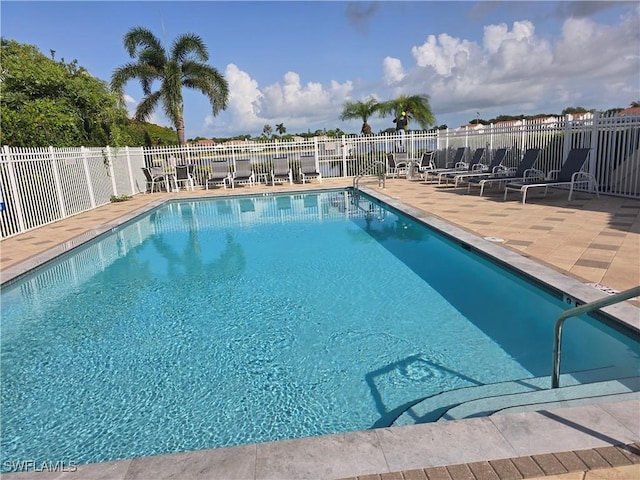 605 Squire Cir Unit 203, Naples, FL 34104 - community pool featuring a patio