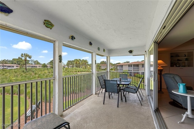 601 Teryl Rd Unit 2262, Naples, FL 34112 - sunroom / solarium featuring outdoor dining area
