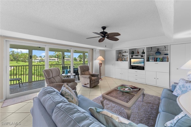 601 Teryl Rd Unit 2262, Naples, FL 34112 - living room with light tile patterned flooring, a textured ceiling, and ceiling fan