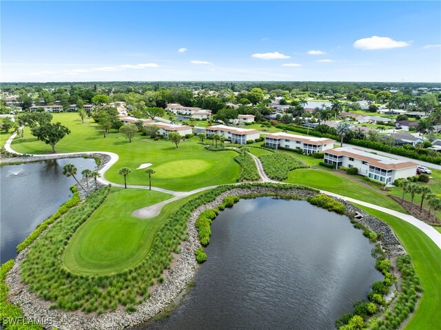 601 Teryl Rd Unit 2262, Naples, FL 34112 - drone / aerial view of a large body of water, a golf course, and a tree filled landscape