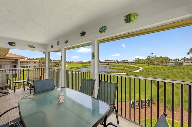 601 Teryl Rd Unit 2262, Naples, FL 34112 - sunroom / solarium with a water view and outdoor dining area