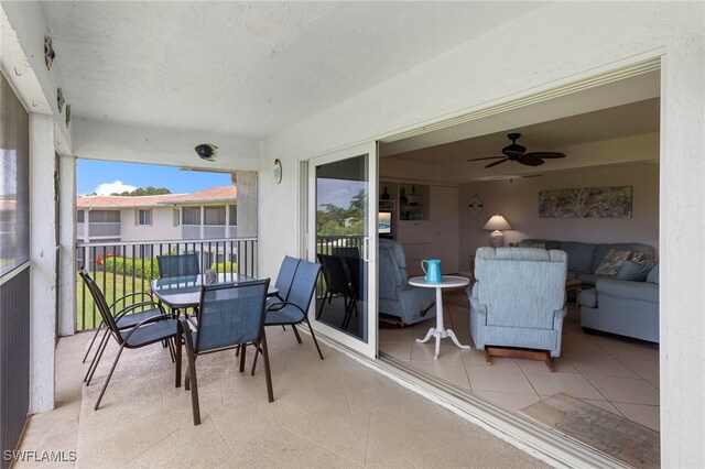 601 Teryl Rd Unit 2262, Naples, FL 34112 - sunroom with a ceiling fan, outdoor dining area, and outdoor lounge area