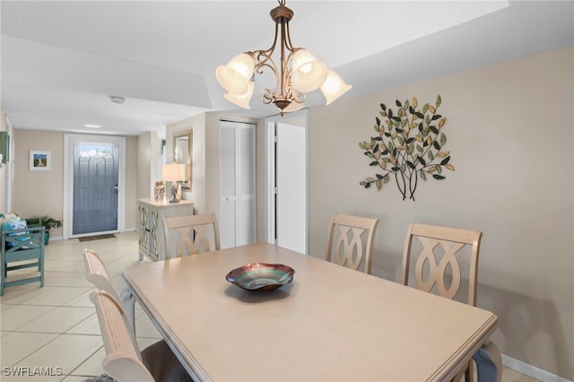 601 Teryl Rd Unit 2262, Naples, FL 34112 - dining space with light tile patterned floors, a chandelier, and baseboards