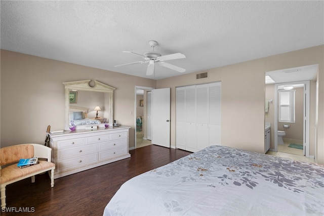 601 Teryl Rd Unit 2262, Naples, FL 34112 - bedroom featuring wood finished floors, a textured ceiling, a closet, a ceiling fan, and baseboards