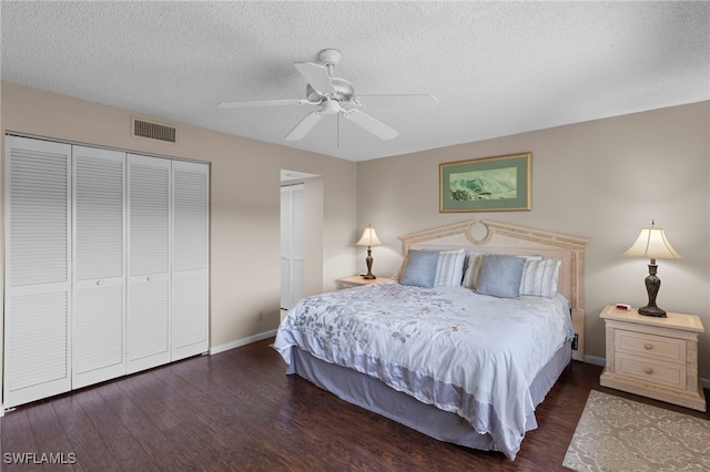 601 Teryl Rd Unit 2262, Naples, FL 34112 - bedroom featuring a textured ceiling, wood finished floors, baseboards, a ceiling fan, and two closets