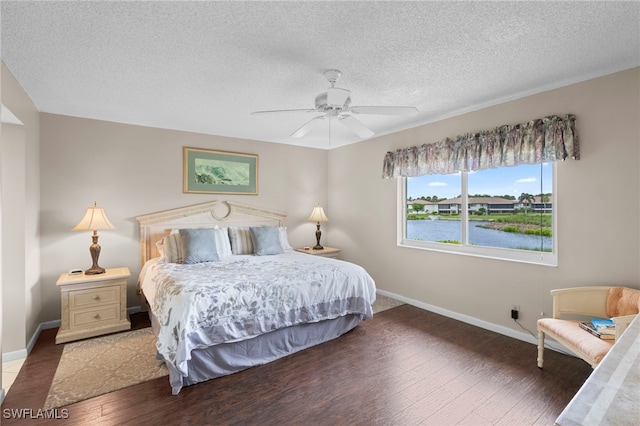 601 Teryl Rd Unit 2262, Naples, FL 34112 - bedroom featuring wood finished floors, baseboards, a textured ceiling, and a ceiling fan