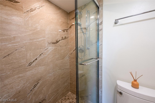 3055 Riviera Dr Unit 306, Naples, FL 34103 - bathroom featuring toilet and a shower stall