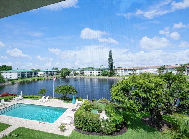 3055 Riviera Dr Unit 306, Naples, FL 34103 - swimming pool featuring a patio and a water view
