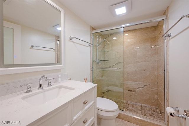 3055 Riviera Dr Unit 306, Naples, FL 34103 - full bath with toilet, a stall shower, vanity, and tile patterned flooring