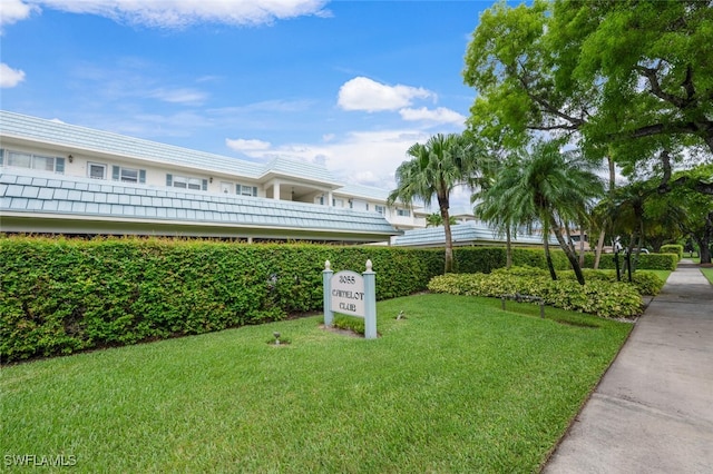 3055 Riviera Dr Unit 306, Naples, FL 34103 - view of community with a lawn