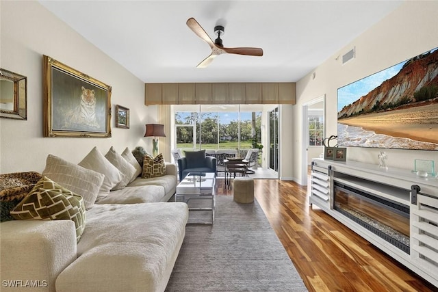 1940 Willow Bend Cir Unit 102, Naples, FL 34109 - living area with wood finished floors and ceiling fan